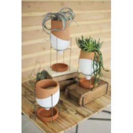 Set Of Three Natural And White Clay Pots On Wire Stands